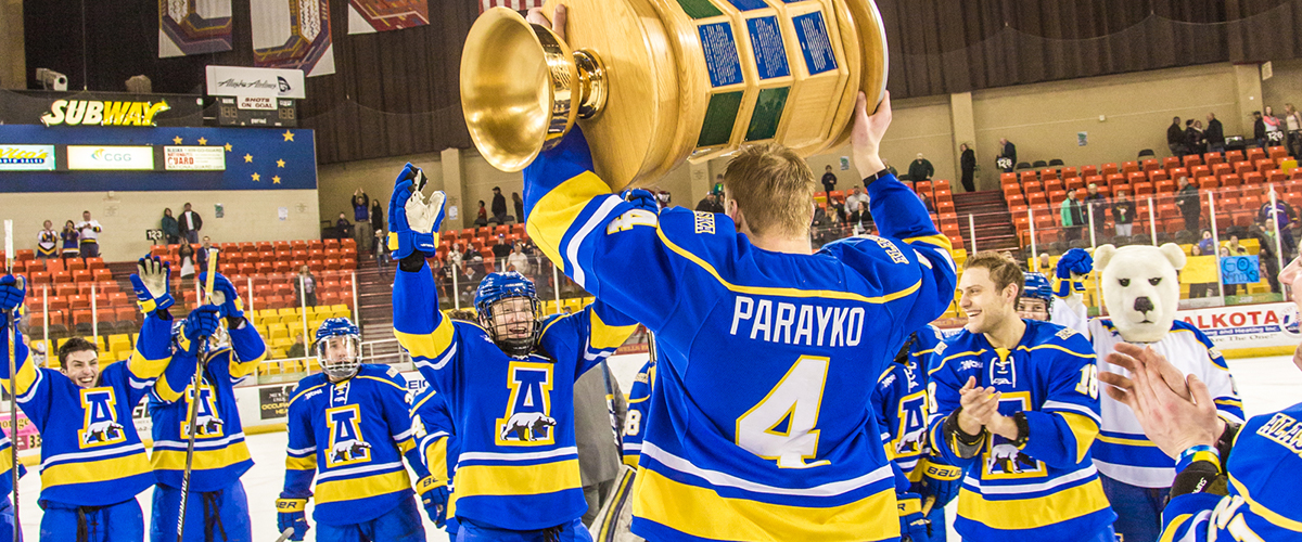 Colton Parayko carrying the Stanley Cup to his teammates after the win.