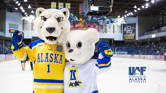 Alaska Nanook and Junior Nanook mascots on the ice rink at the Carlson Center with the UAF logo in the lower right corner.